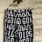 1990s Moschino Print 'Logo' Trousers